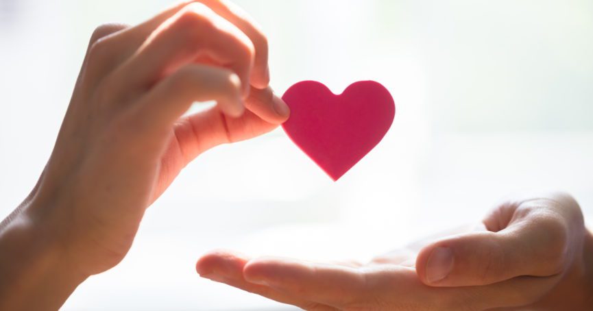 two hands giving heart